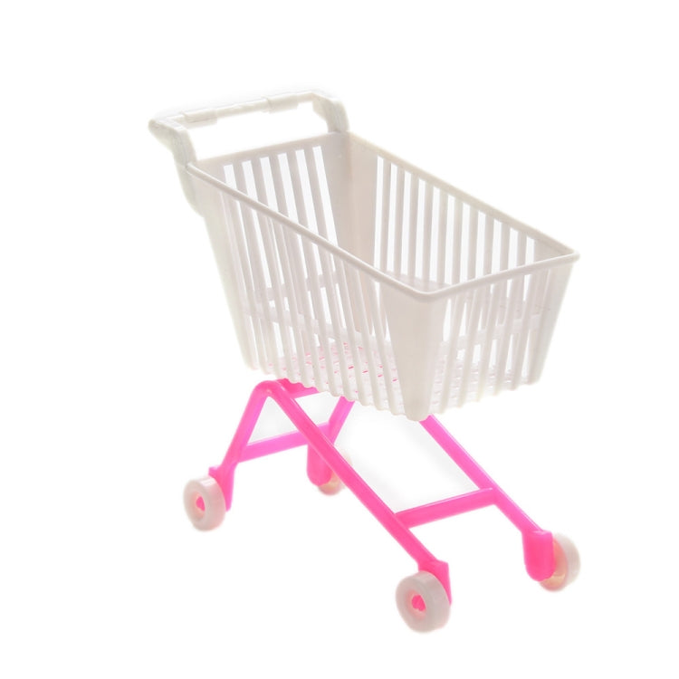 Doll shopping cart toy featuring a white basket on a pink wheeled base