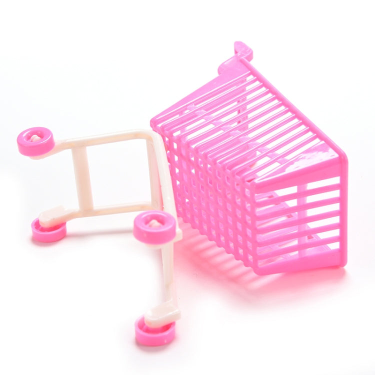 Mini doll shopping cart toy with pink basket, beige handle frame, and pink wheels