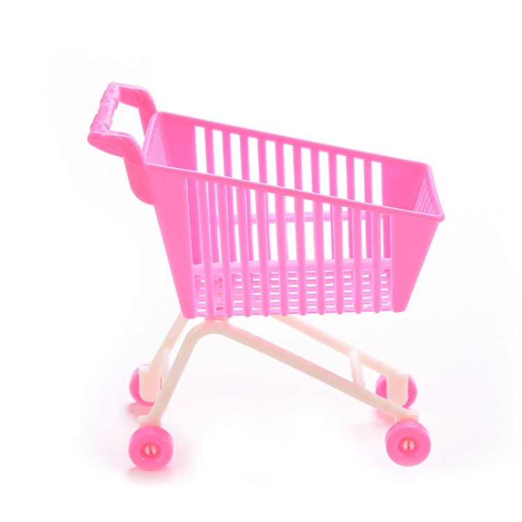 Doll shopping cart toy with pink basket and beige wheeled frame, four caster wheels