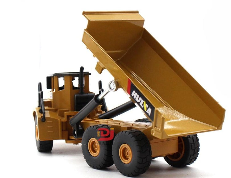 Tan alloy articulated dump truck toy with open bed angled upward and black wheels