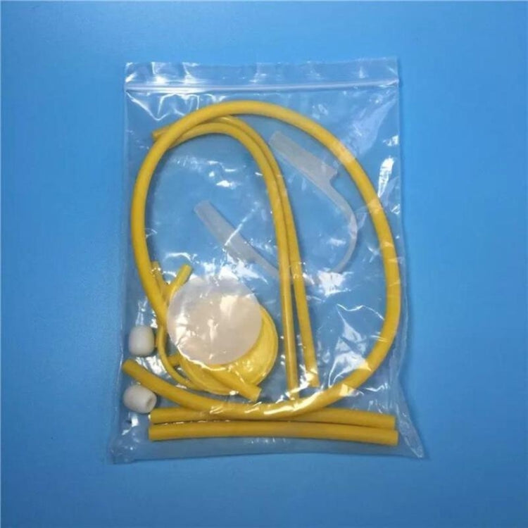 Yellow stethoscope toy parts in clear bag with tubing and chest piece