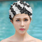 Black and white 3D floral swimming cap with pearl-like bead accents