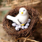 Rattan bird nest with white chick figurine and mixed white eggs
