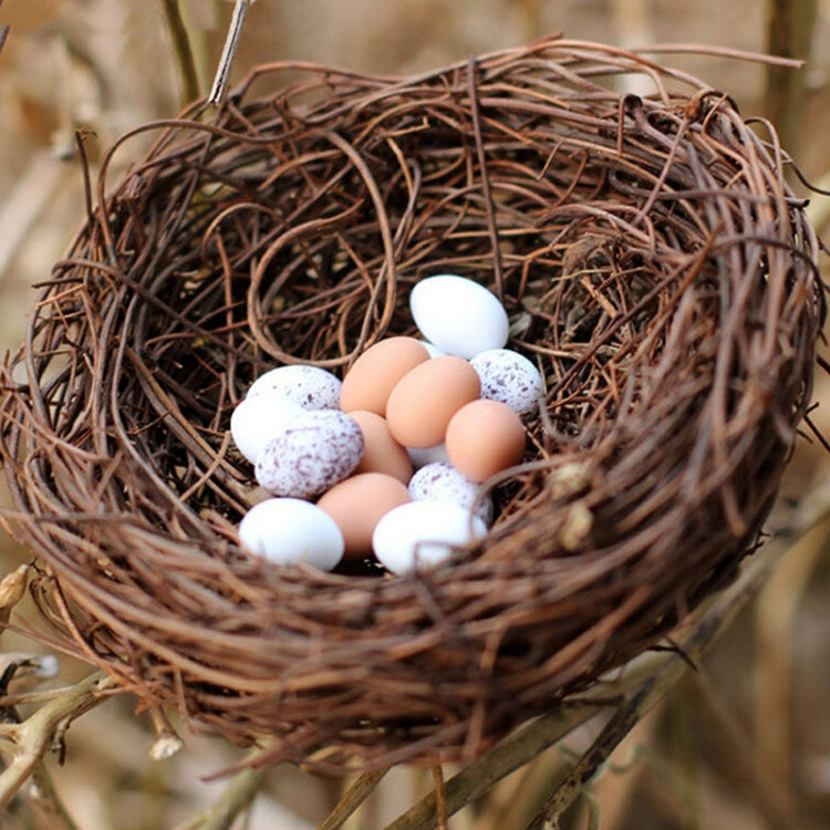 Woven rattan bird nest filled with white and pink eggs