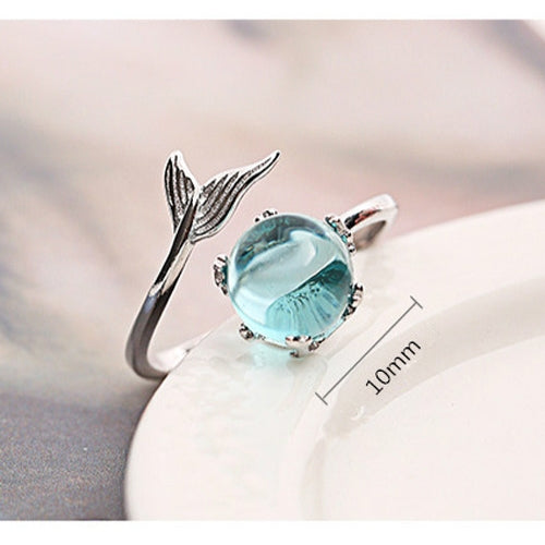 Silver open ring with turquoise oval gemstone, fish-tail design, and size marker text