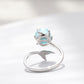 Silver open ring with turquoise cabochon gemstone and mermaid-like crown detail