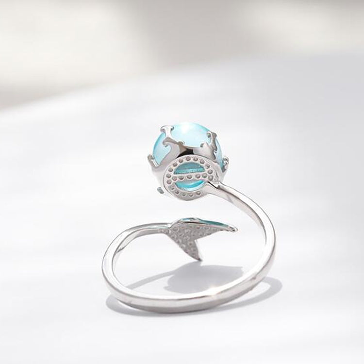 Silver open ring with turquoise cabochon gemstone and mermaid-like crown detail