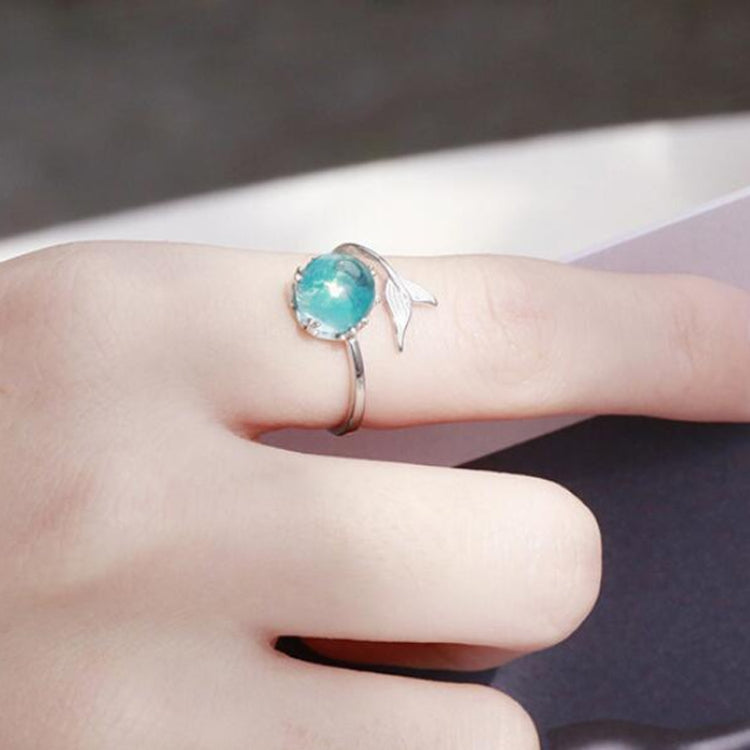 Turquoise crystal open ring with small fish-tail charm on the band