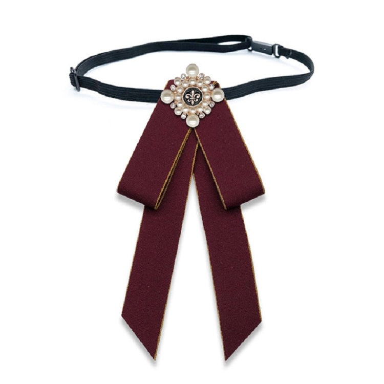 Maroon cloth bow-knot tie with pearl flower center, long tails on black neck strap