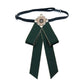 Dark green cloth bow-knot tie with pearl flower center, long tails on black neck strap