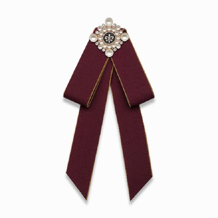 Maroon cloth bow-knot accessory with pearl flower center and long ribbon tails