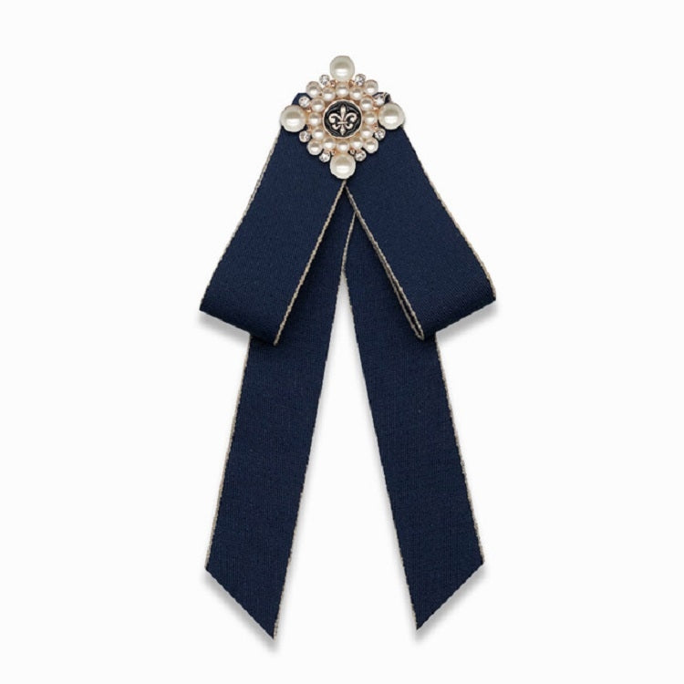 Navy cloth bow-knot accessory with pearl flower center and long ribbon tails