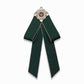 Dark green cloth bow-knot accessory with pearl flower center and long ribbon tails