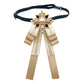 Champagne lace bow accessory on a dark choker strap with pearl centerpiece and ribbons