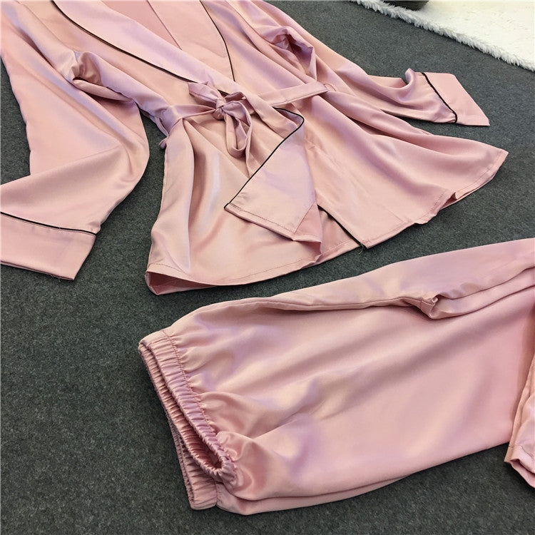 Silk-look pink robe pajama top and matching pants set with tie waist and trimmed cuffs