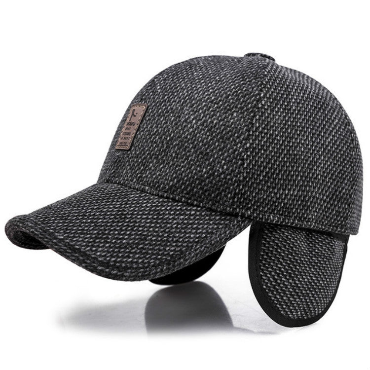 Dark gray textured baseball cap with curved brim, ear flaps, and leather logo patch