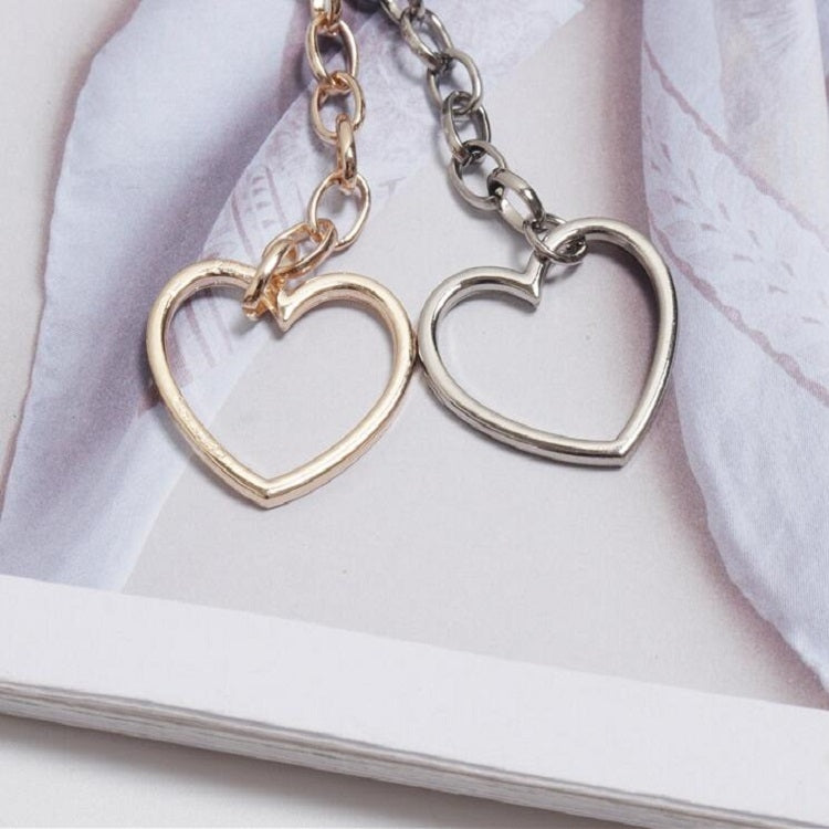 Heart pendant waist chain with gold- and silver-tone linked heart charms and chain