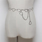 Silver-tone heart link waist chain with dangling heart charms on a belt