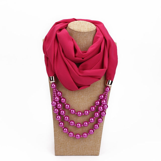 Rose pink scarf with magenta imitation pearl necklace, layered glossy round beads