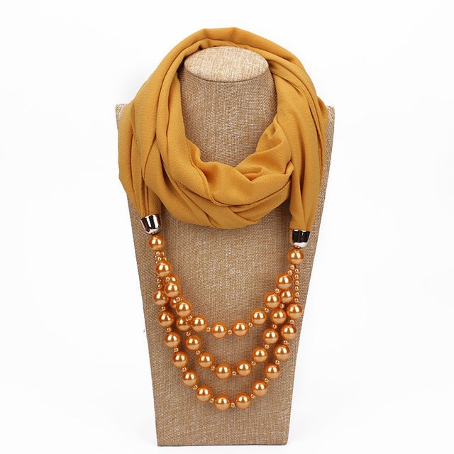Apricot scarf with copper-gold imitation pearl necklace, multi-strand bead design
