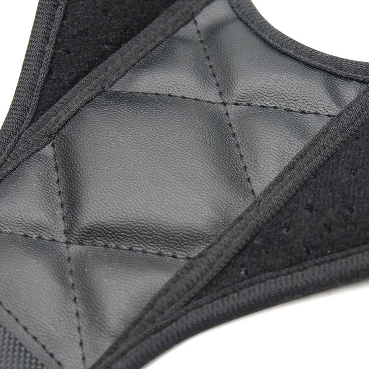 Black posture brace fabric detail with gray center panel and stitched seams, textured padding