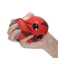 Red squishy can toy being squeezed; gray lid and cute face visible