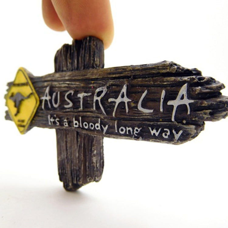 Kangaroo Australia fridge magnet close-up, dark wooden cross sign with yellow icon