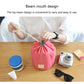Red cylindrical drawstring cosmetic bag with bundled top and small front label