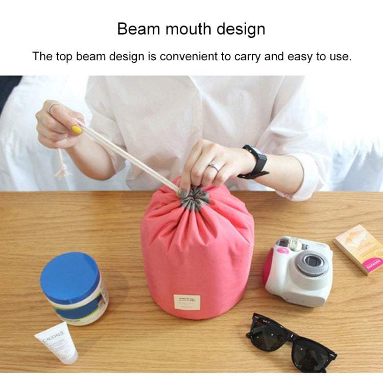 Red cylindrical drawstring cosmetic bag with bundled top and small front label