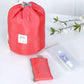 Red cylindrical drawstring wash bag with front label and small matching mini pouch