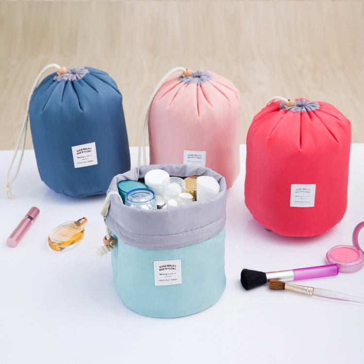 Set of cylindrical wash bags in blue, pink, and red with small pouch included