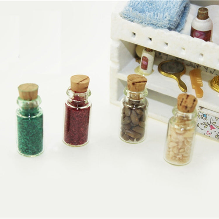 Mini glass food bottles with corks displayed in a dollhouse kitchen set