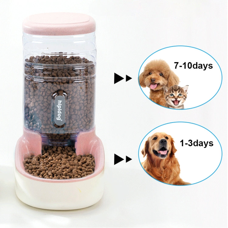 Automatic pet feeder with transparent lid, pink base, and dry kibble inside