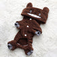 Brown chinchilla fleece dog costume with hood, paw pads, and cartoon face details.