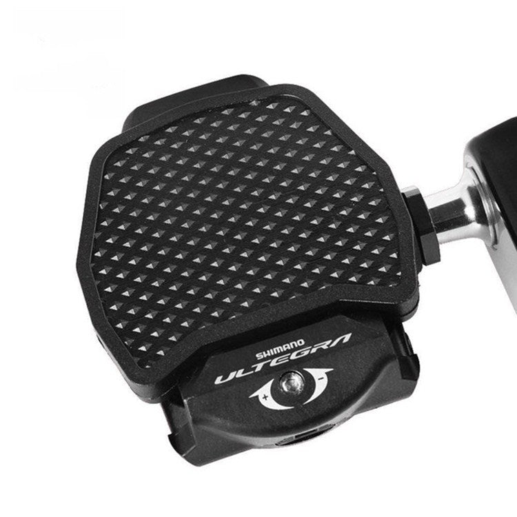 Bike pedal lock to flat converter with textured grip pad and mounting hardware