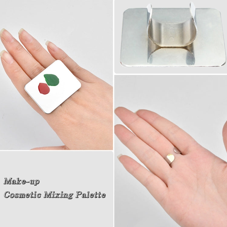 Small square stainless steel mixing palette with makeup swatches on white plate