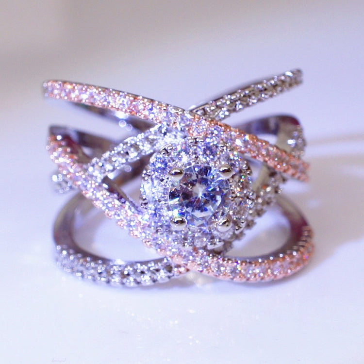 Rose gold and silver-toned cross engagement ring with round clear zircon centerpiece