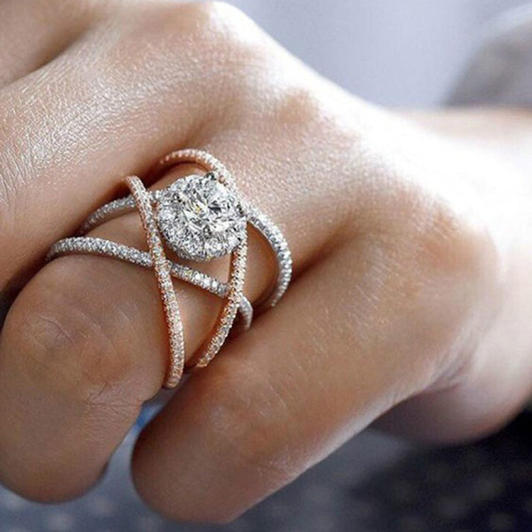 Sparkling cross-design engagement ring in rose gold and silver tones