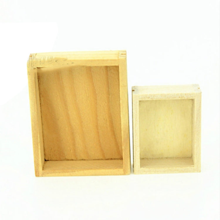 Two mini wooden boxes, one larger and one smaller, open interiors