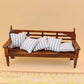 Wooden mini dollhouse bench with slatted back and blue-and-white striped cushions