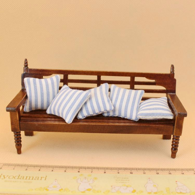Wooden mini dollhouse bench with slatted back and blue-and-white striped cushions