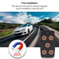 Black magnetic GPS tracker with circular metal pads attached