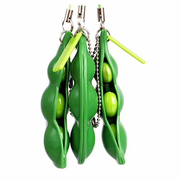 Green extrusion pea keychain toy set of stacked pods with metal keyrings and chains