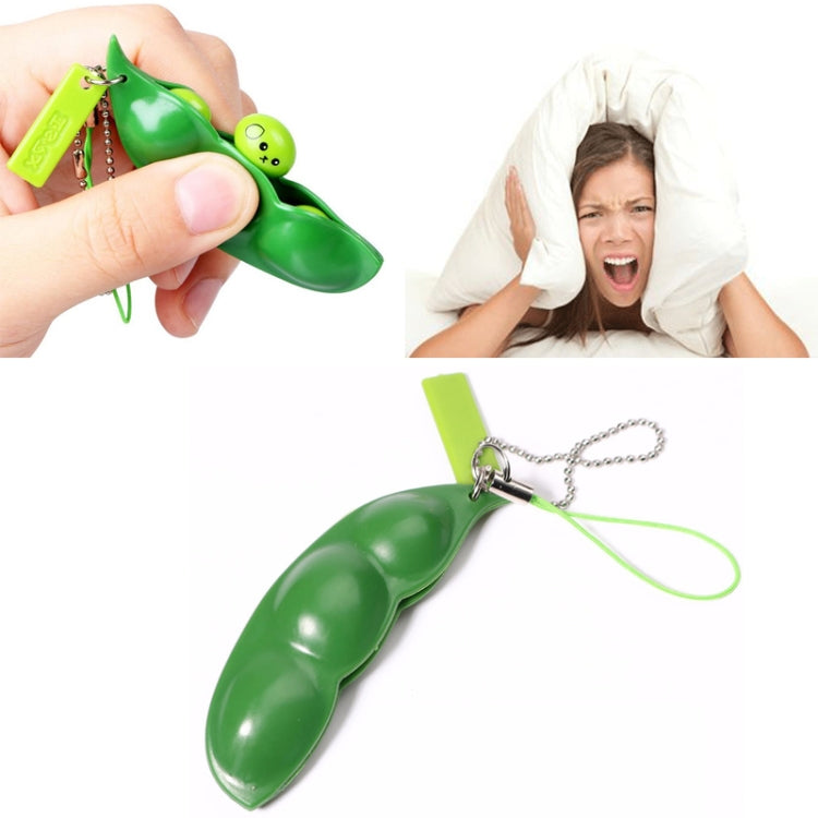 Green extrusion pea keychain pods with small face charm and metal chain