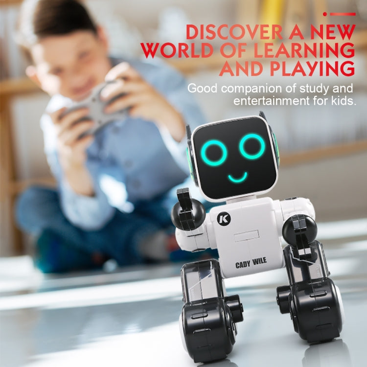 White and black toy robot with glowing blue LED eyes near a child studying.