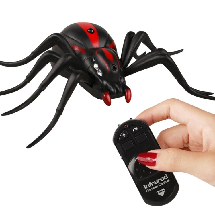Infrared remote control spider toy with red accents and handheld infrared controller