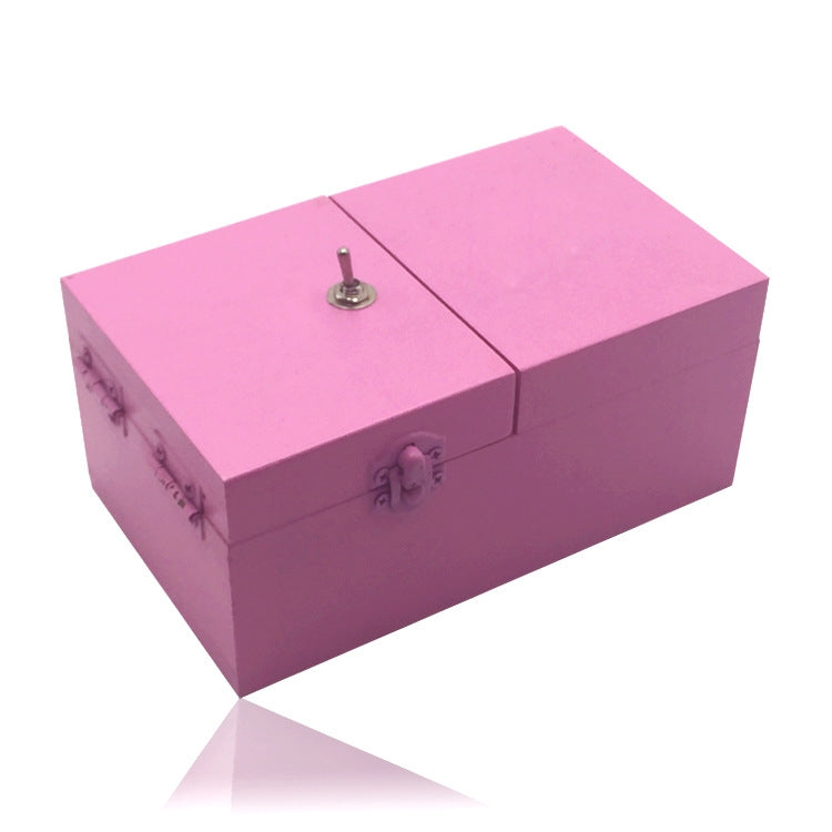 Pink wooden anti-stress box toy with two hinged lids and metal latch knob.