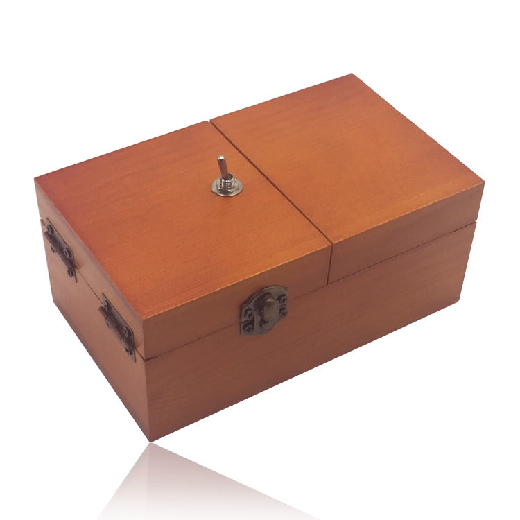 Dark wood anti-stress box toy with two hinged lids and metal latch knob.