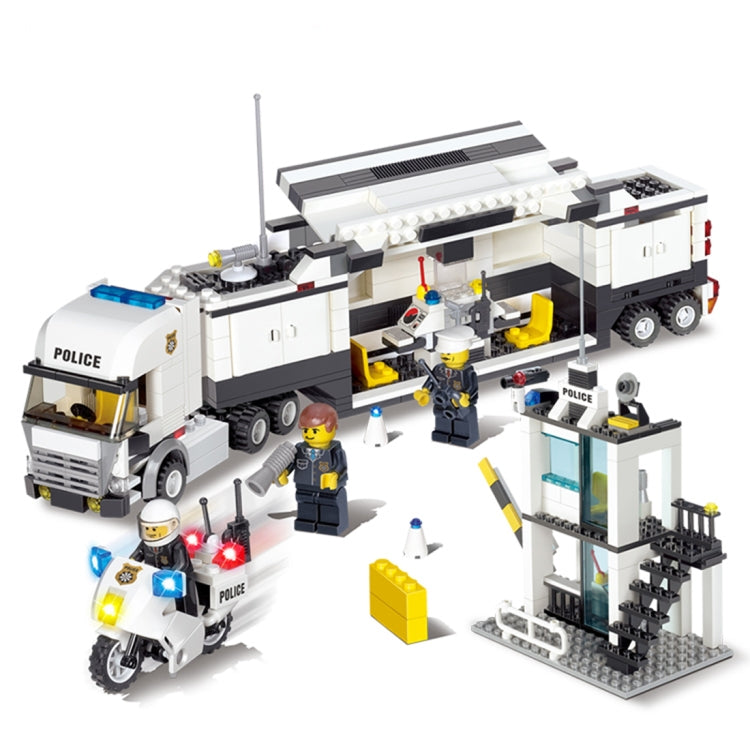 Police station building set with police truck, tower, and officer minifigures in blocks.