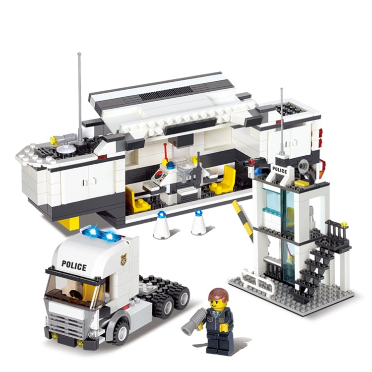 Police station building set with police truck, open interior, tower, and officer minifigures.